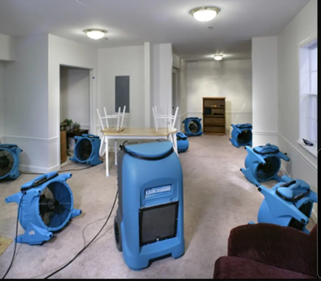 Air movers and dehumidifier setup for Water Damage Restoration in Highland